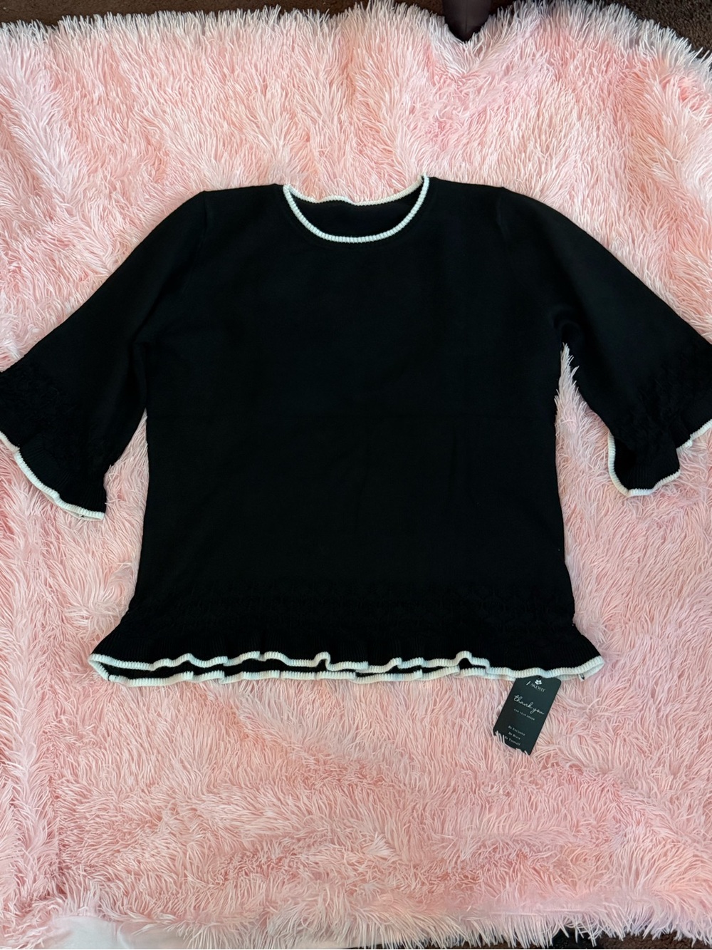 Black Knit Crewneck Top with White Trim and Ruffle Hem